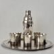 Cocktail shaker service & cups in silver metal