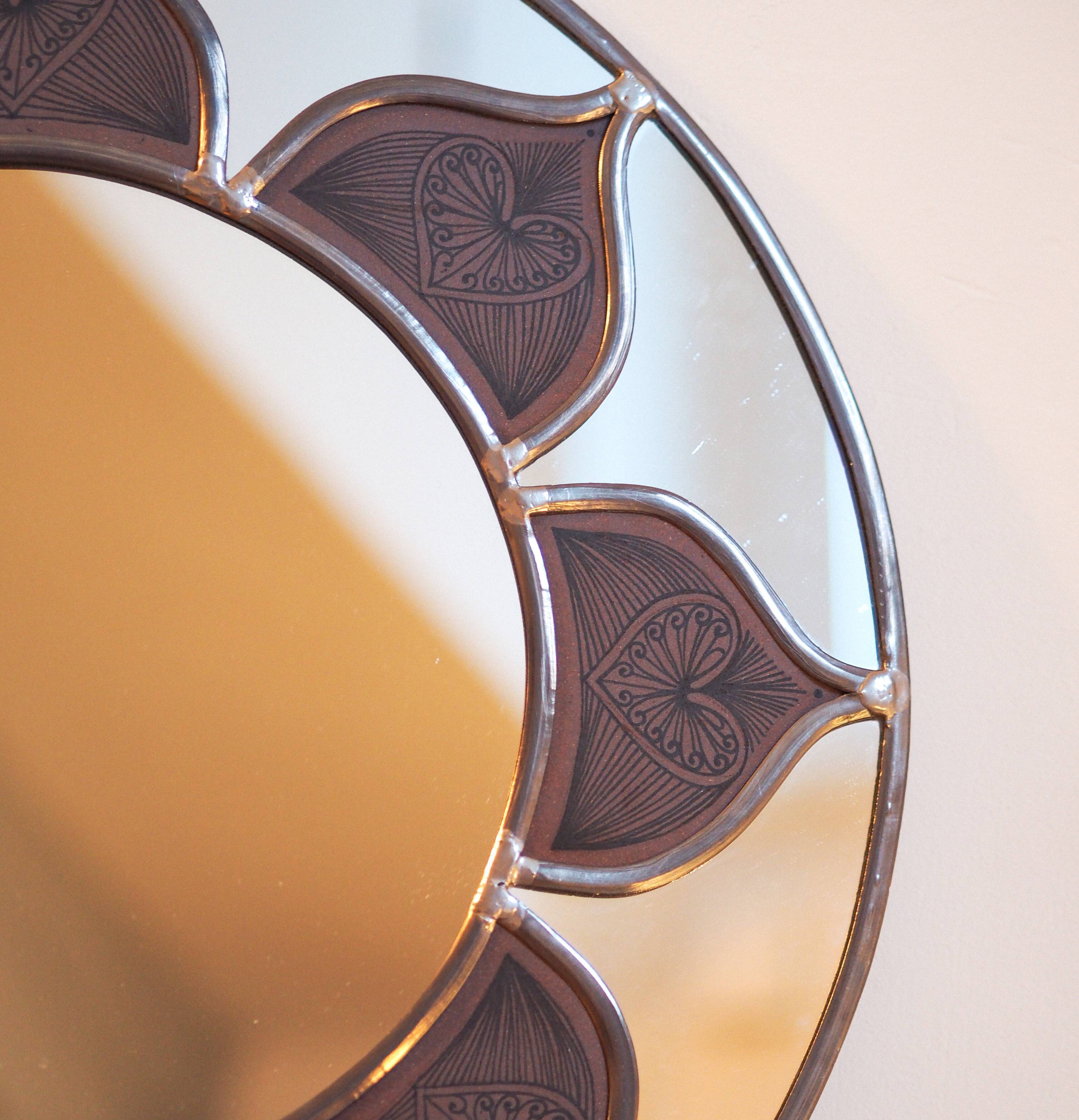 Mirror sun stained glass and ceramic inclusions