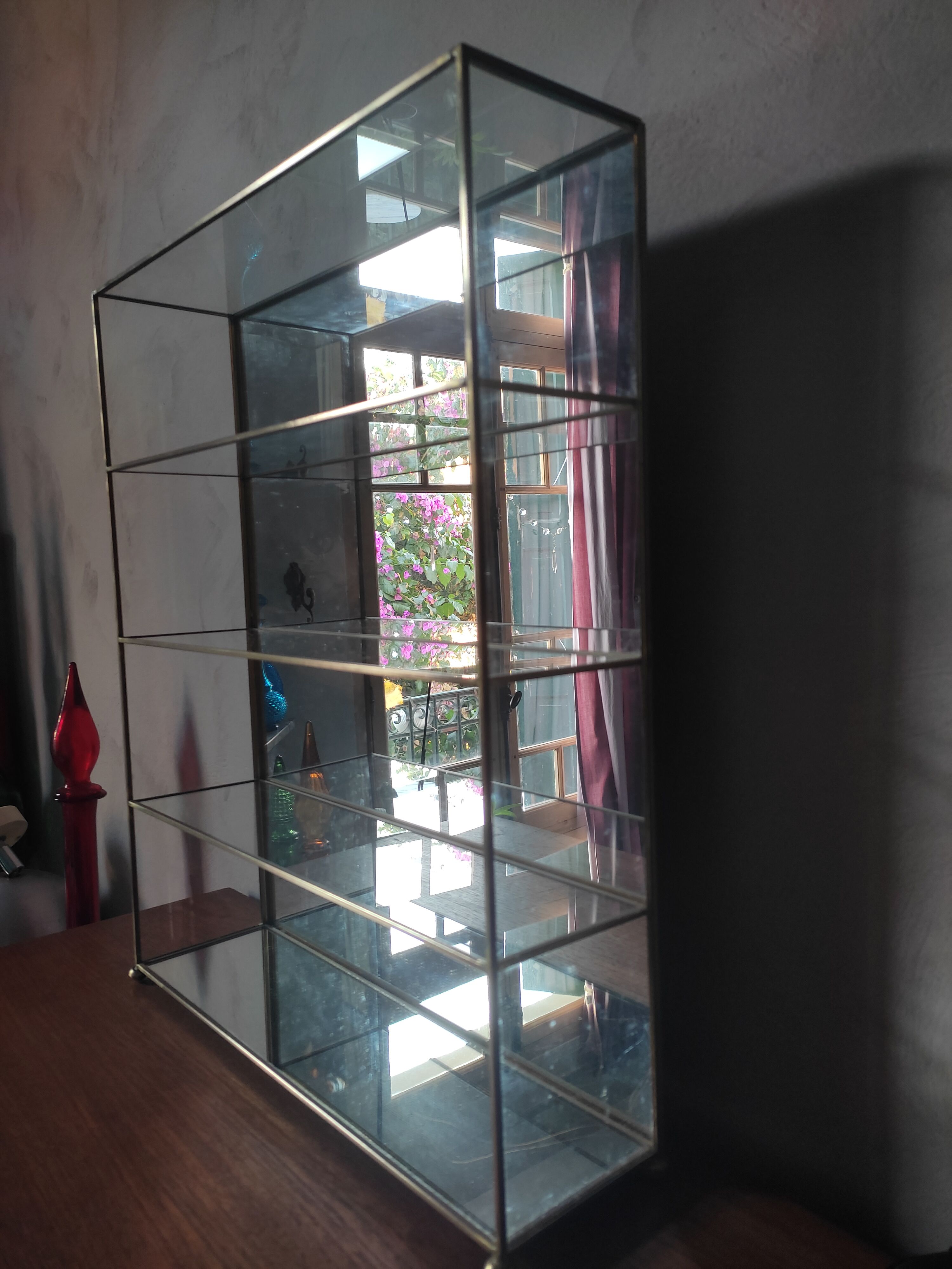 Glazed brass shelf to install