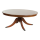 Table basse avec un plateau en cuir rouge de style anglais du 20e siècle.