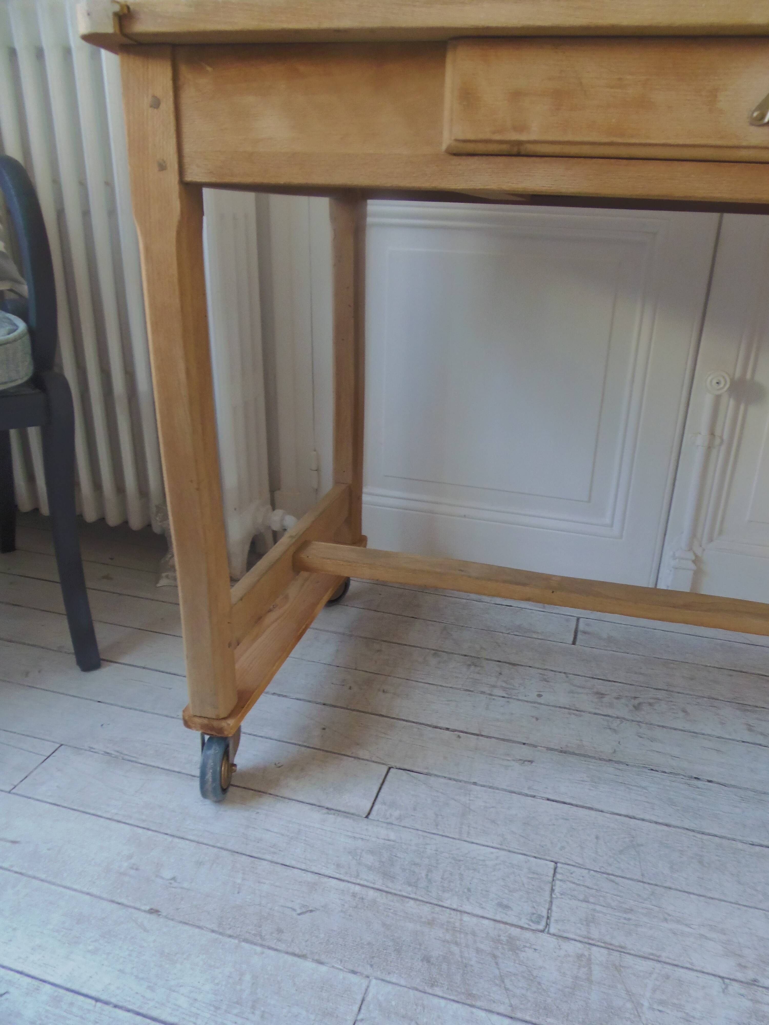 Vintage kitchen table on casters.