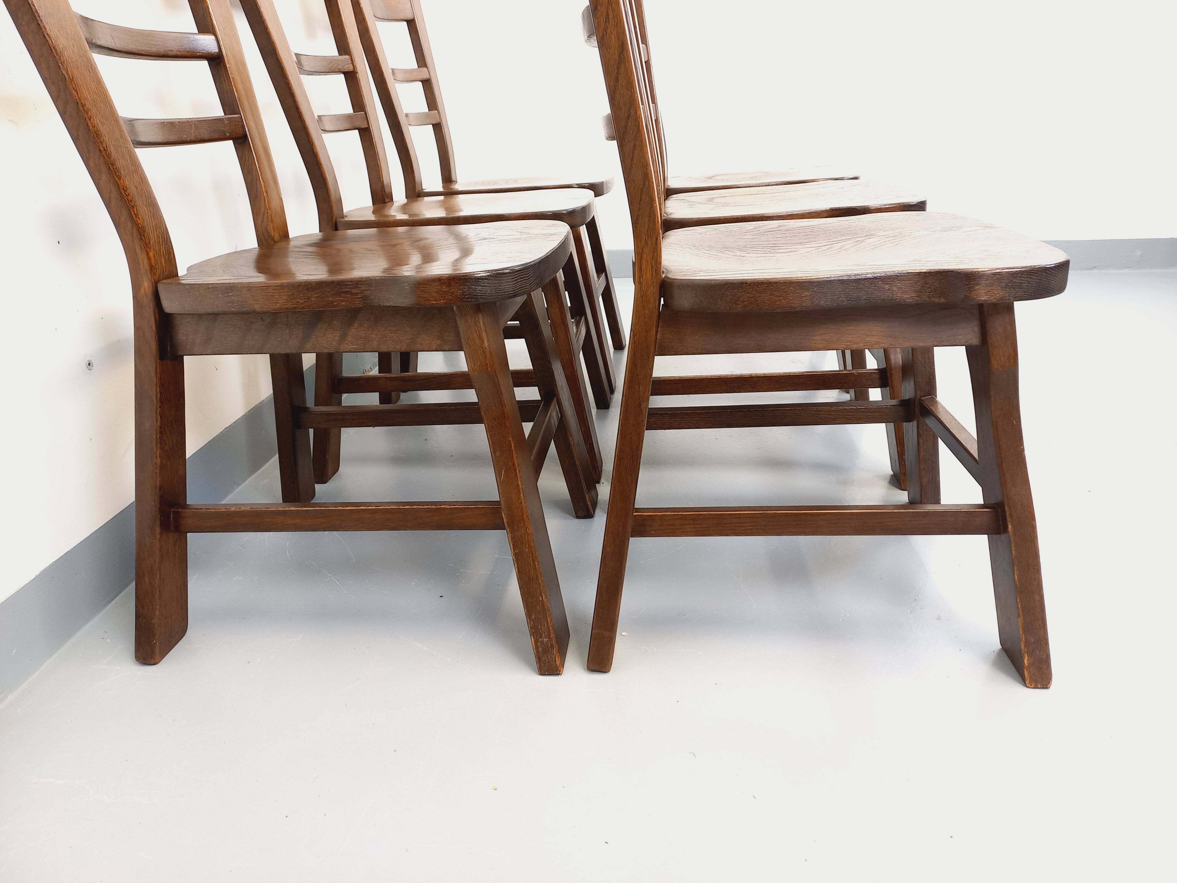 Set of 6 vintage brutalist oak chairs from the 1950s.