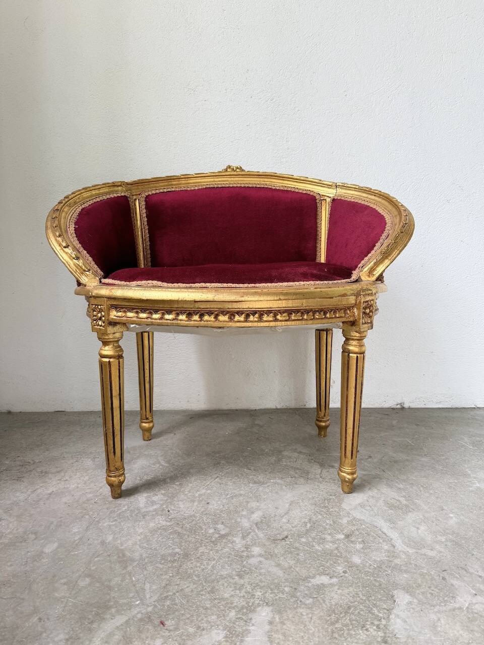 Louis XVI gilt wood and red velvet armchair