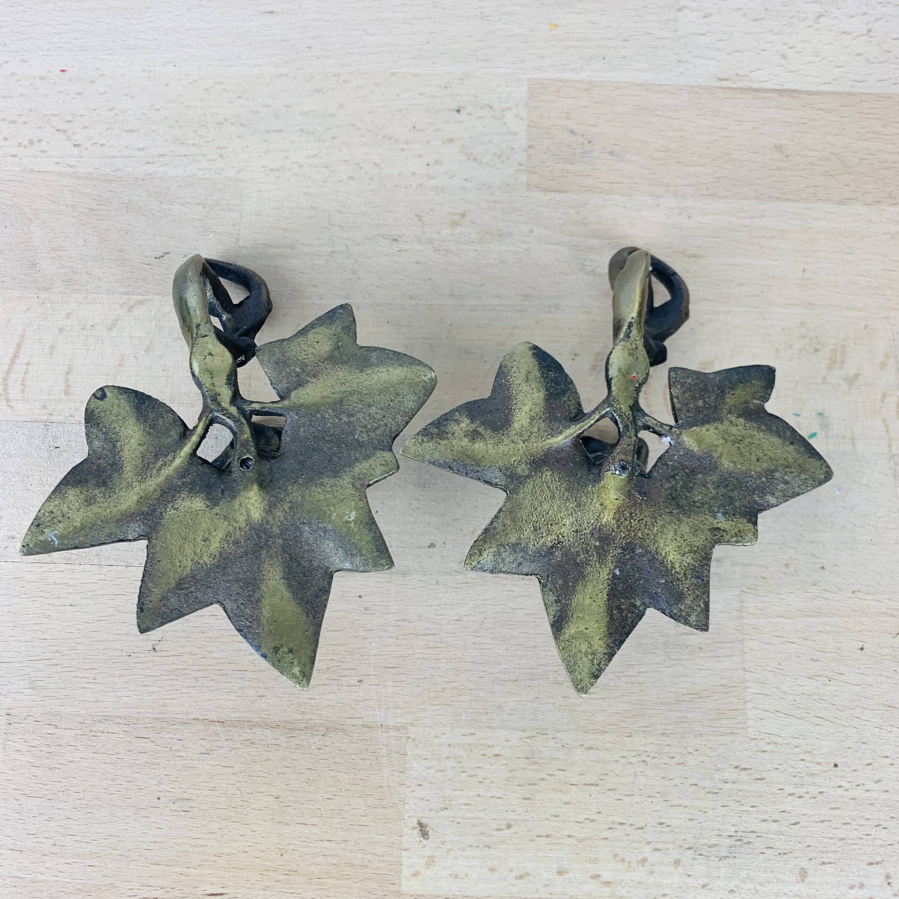 Pair of brass flower candlesticks, cellar