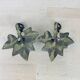 Pair of brass flower candlesticks, cellar