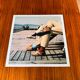 ⸻  Vintage Color Photograph from 1973 – Shoes on Wooden Deck
