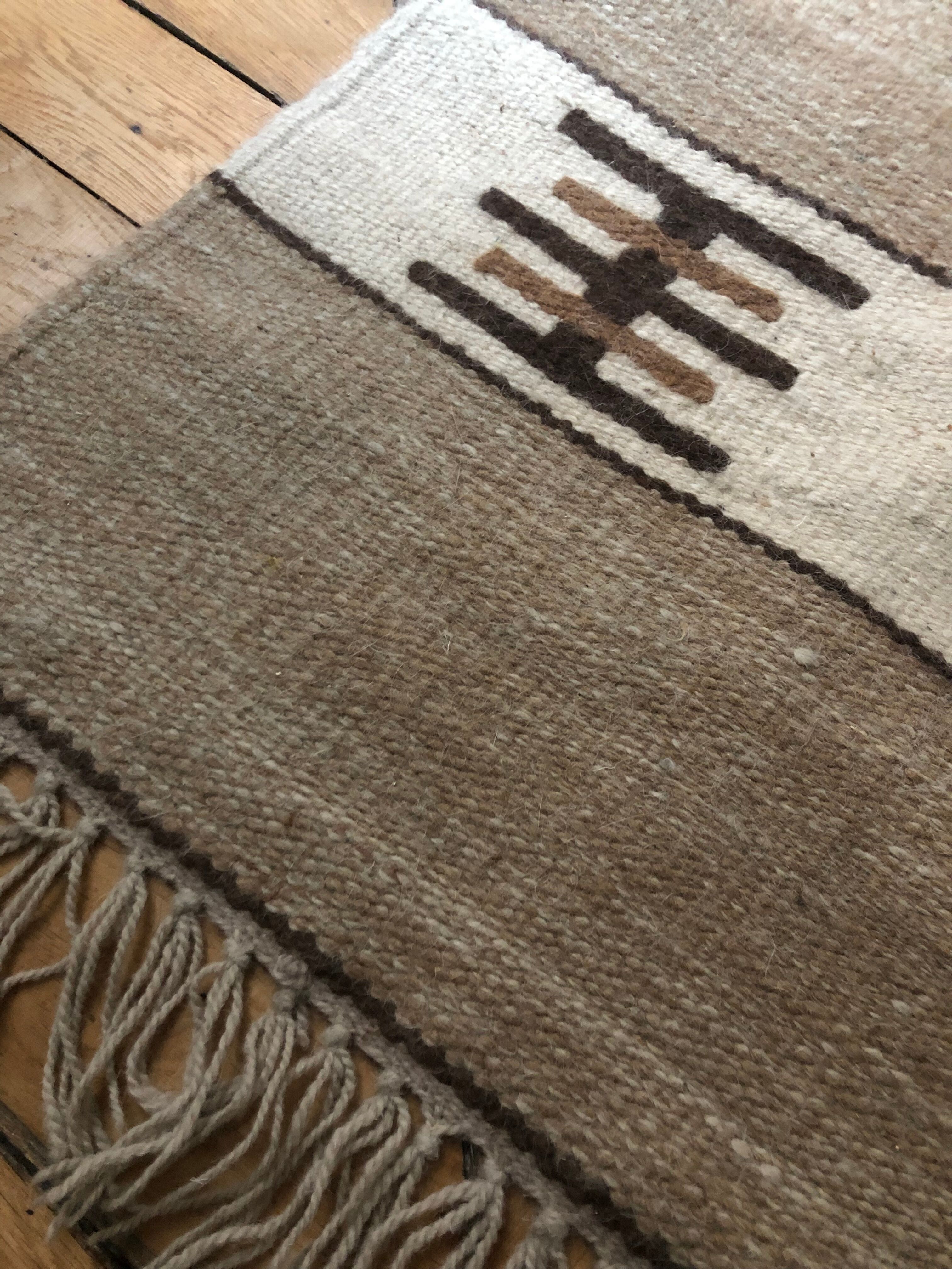 Beige wool rug 68x130cm