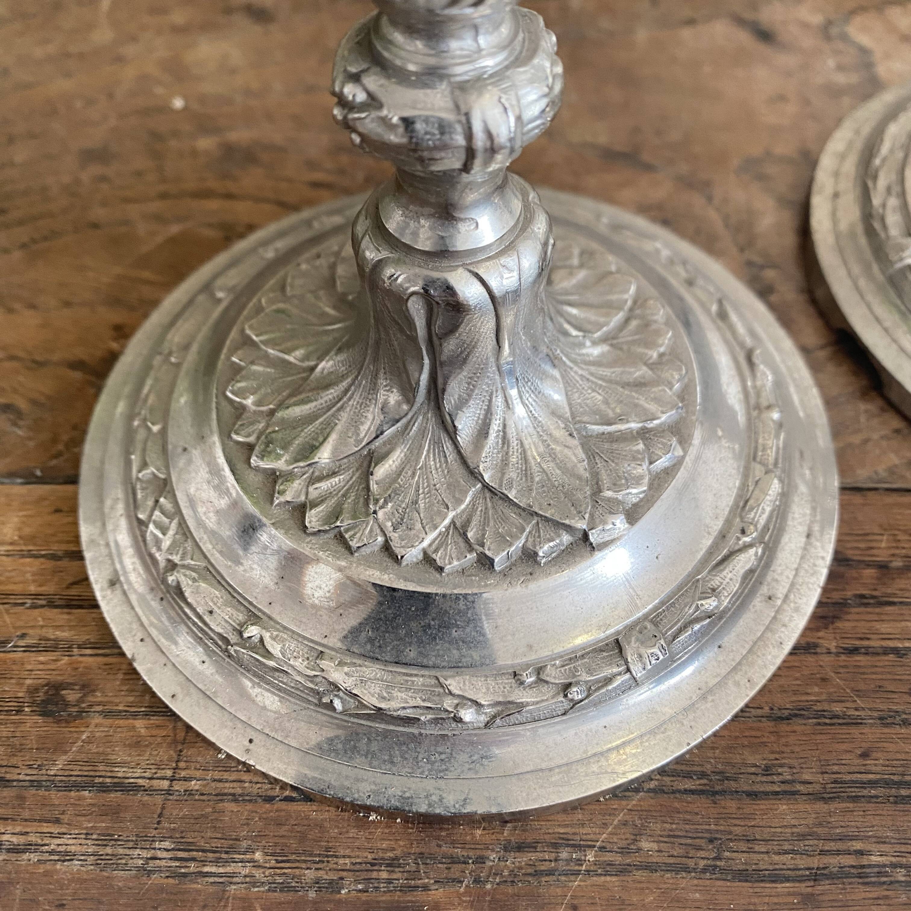 Antique silver-plated metal candlesticks