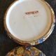 Porcelain candy with enamelled floral decorations. Pretty colors on a golden background.