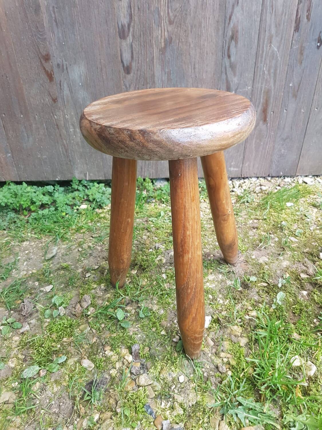 Old vintage wooden tripod milking stool
