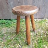 Old vintage wooden tripod milking stool