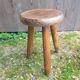Old vintage wooden tripod milking stool