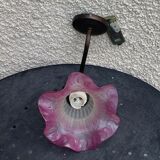 Metal wall lamp with frosted glass shade in the shape of a pink corolla