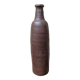 Old handmade terracotta bottle