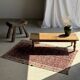 Brown Indonesian teak coffee table, with a border and cylindrical legs H40 L103.