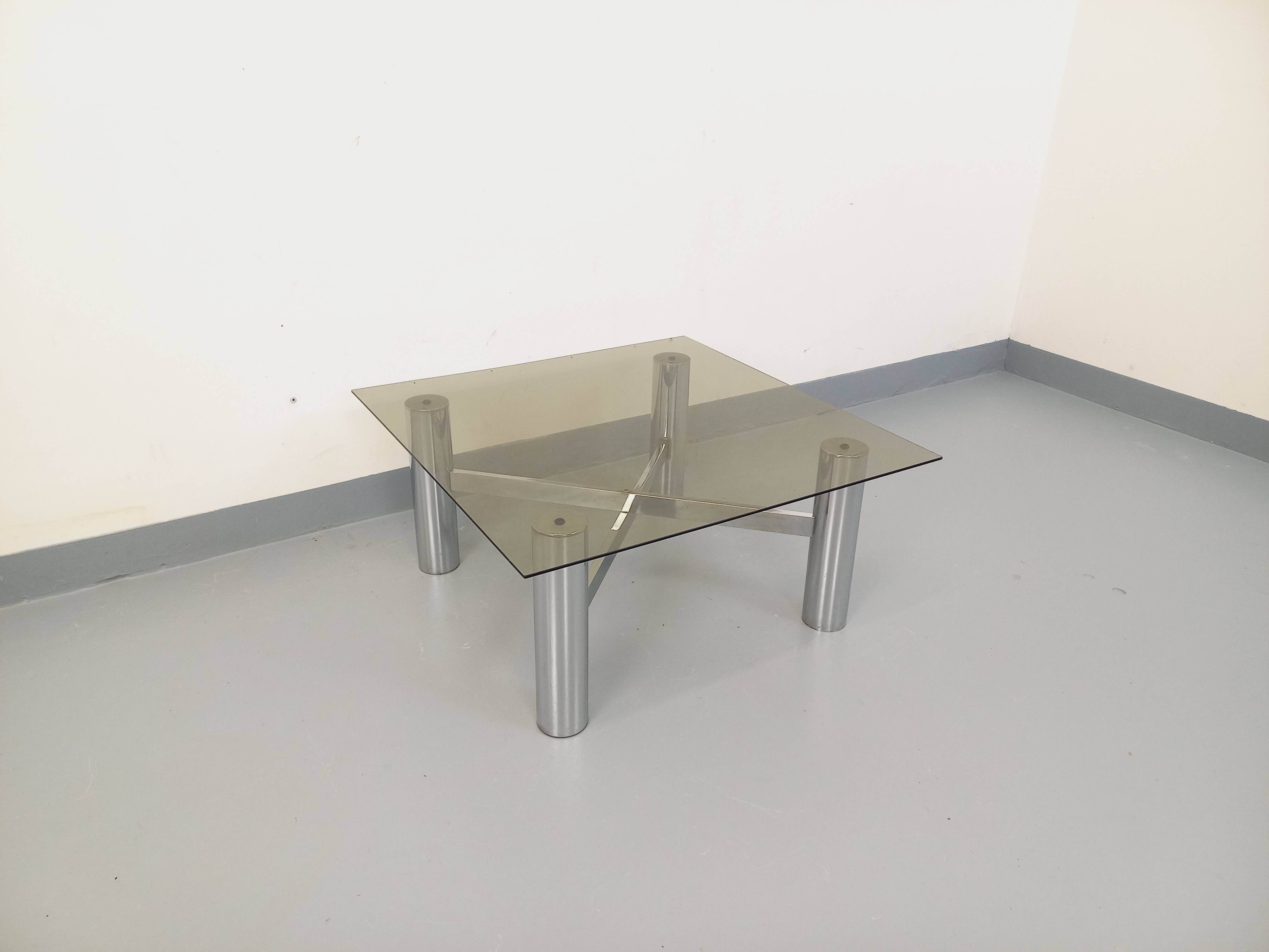 Square Italian vintage Space Age coffee table in smoked glass and metal.
