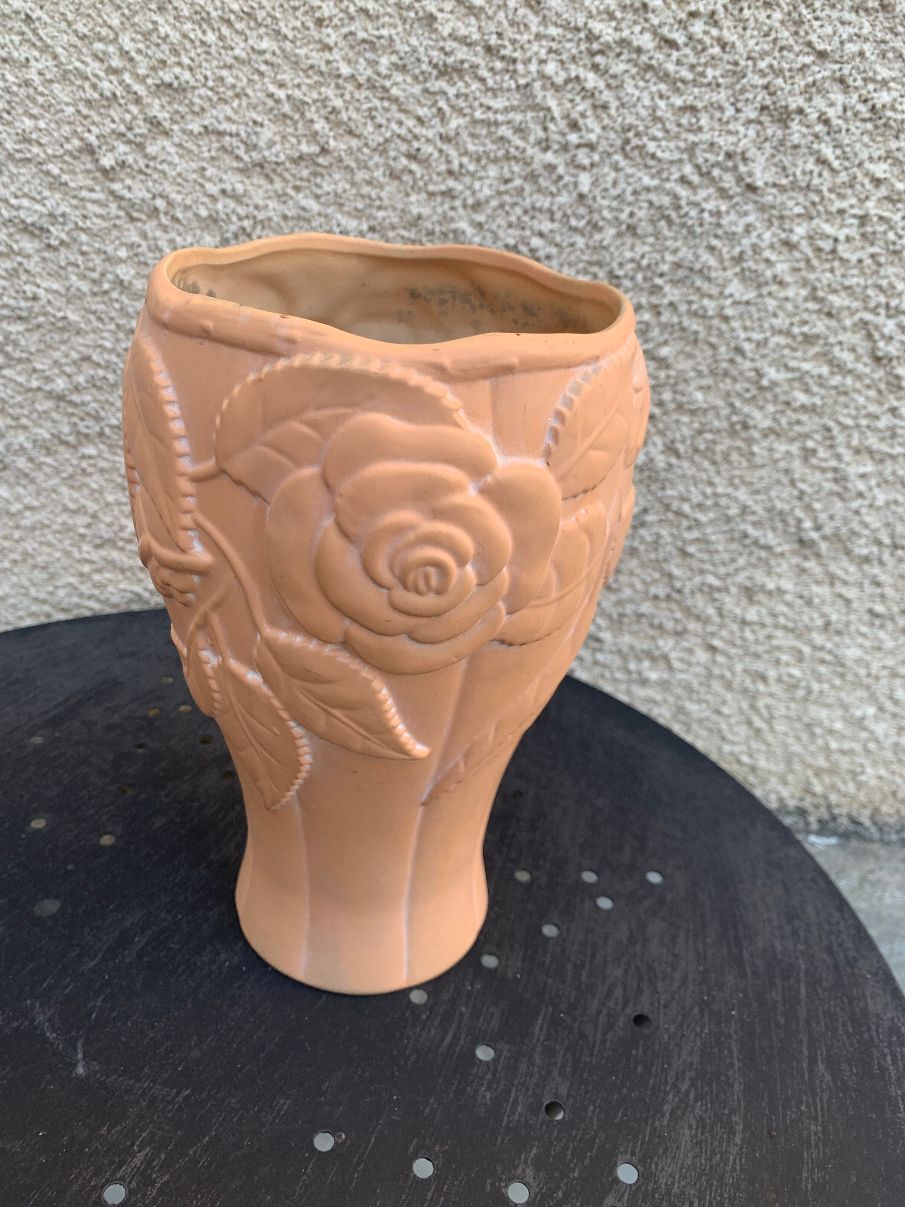 Terracotta vase with a vintage ceramic relief rose pattern