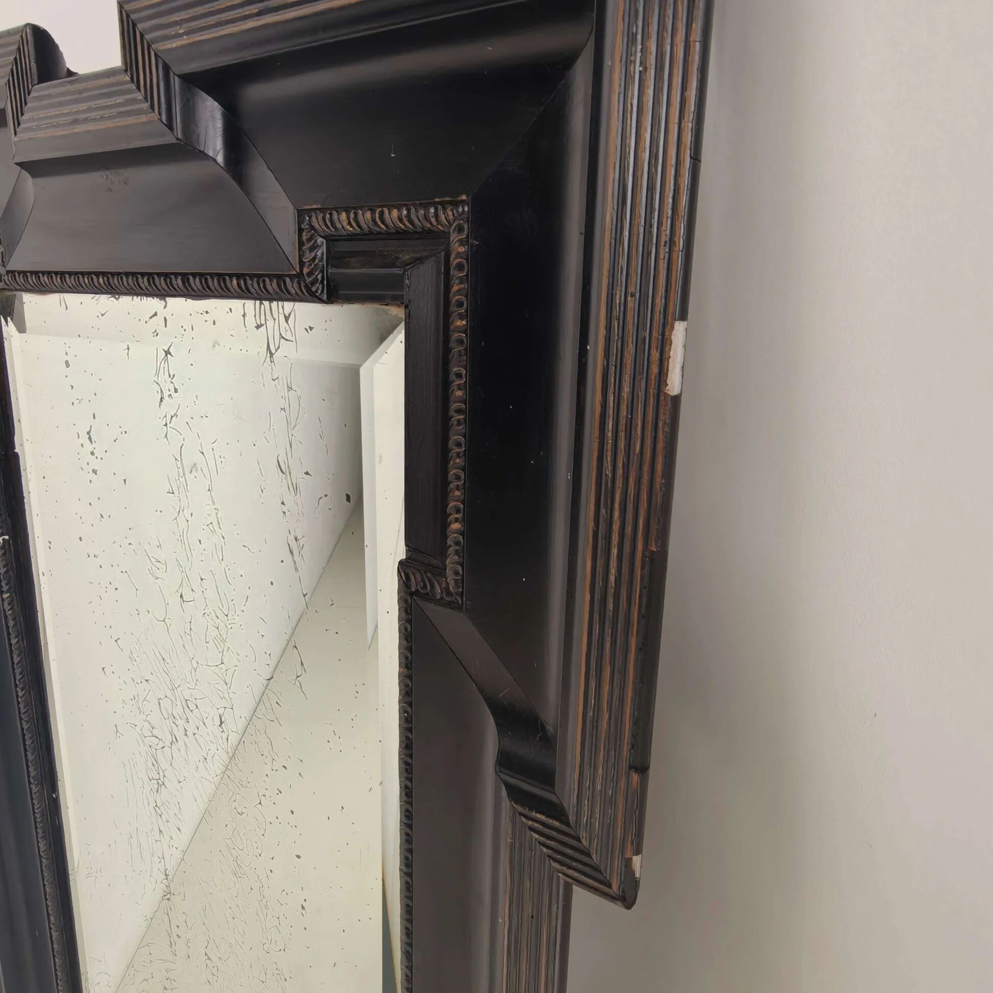 Late 19th century ebonised mirror with original foxed glass