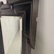 Late 19th century ebonised mirror with original foxed glass