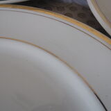 Set of 11 flat white earthenware plates with gold edging