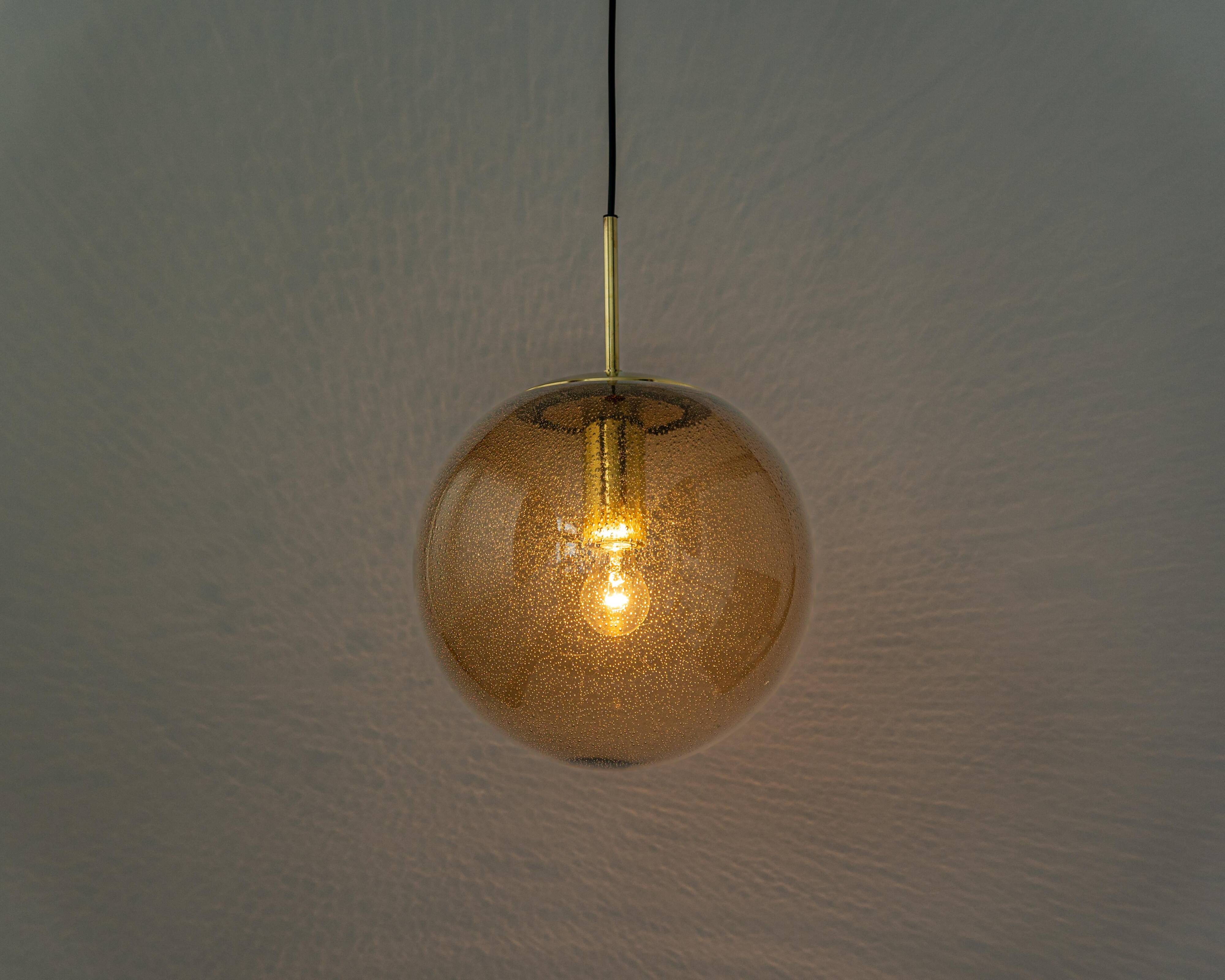 Large smoked glass ball pendant by Limburg with brass, Germany, 1970s.
