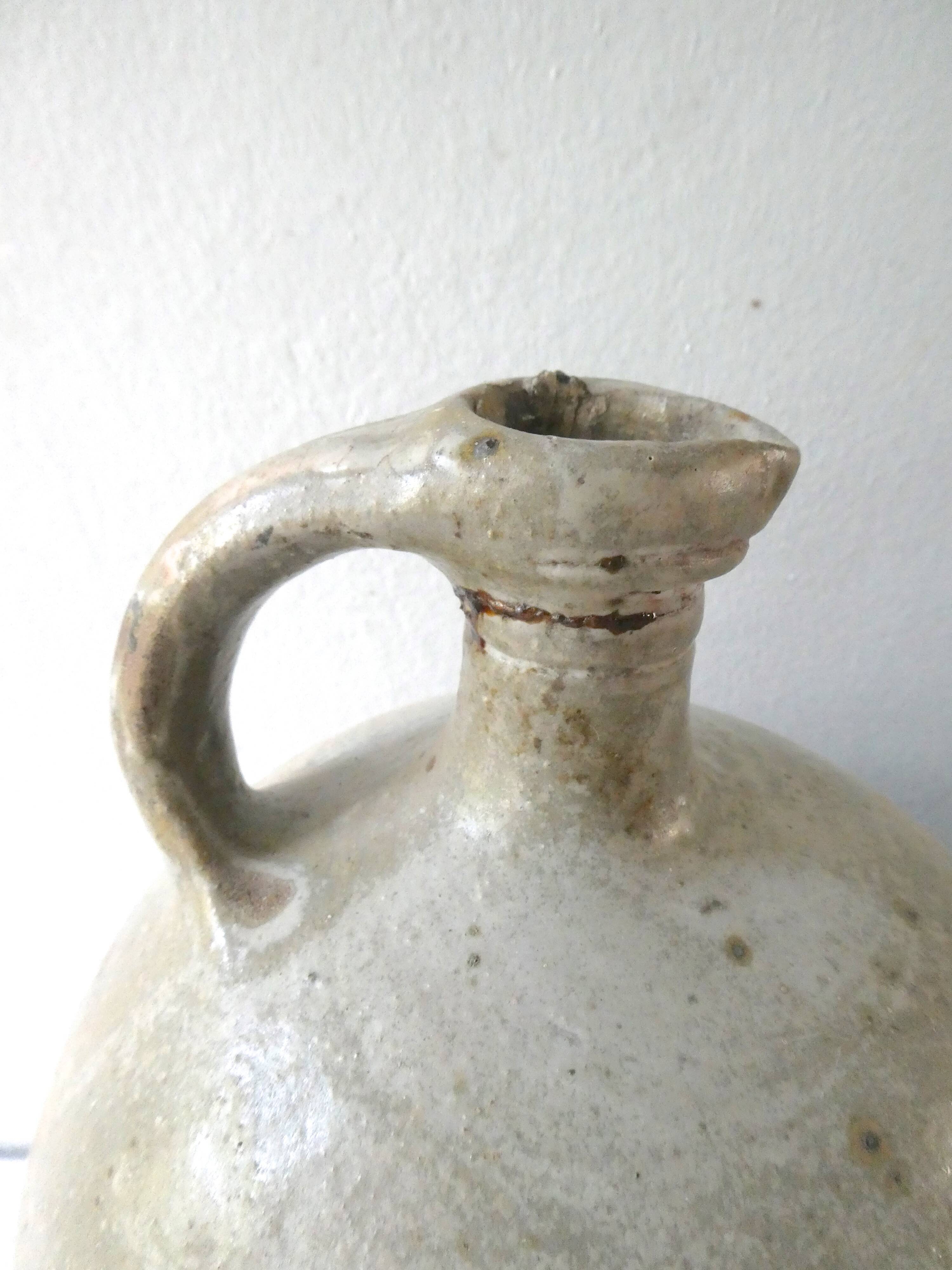 Old bonbonne in glazed stoneware