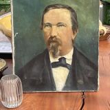 PORTRAIT OF A MAN WITH AN EARRING SIGNED P GARNIER