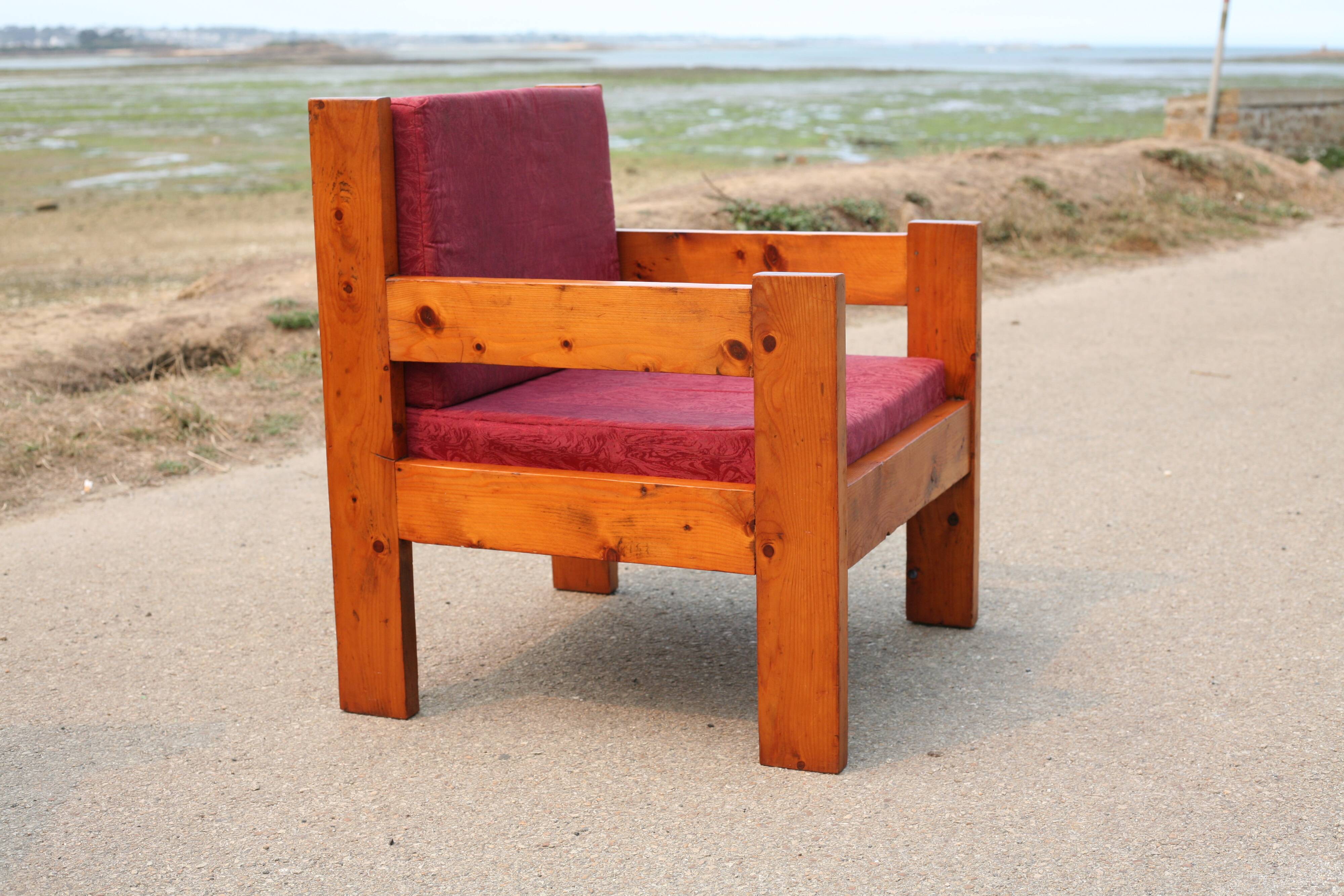 Pair of pine fireside chairs, France, 1960s, "raspberry" cushions