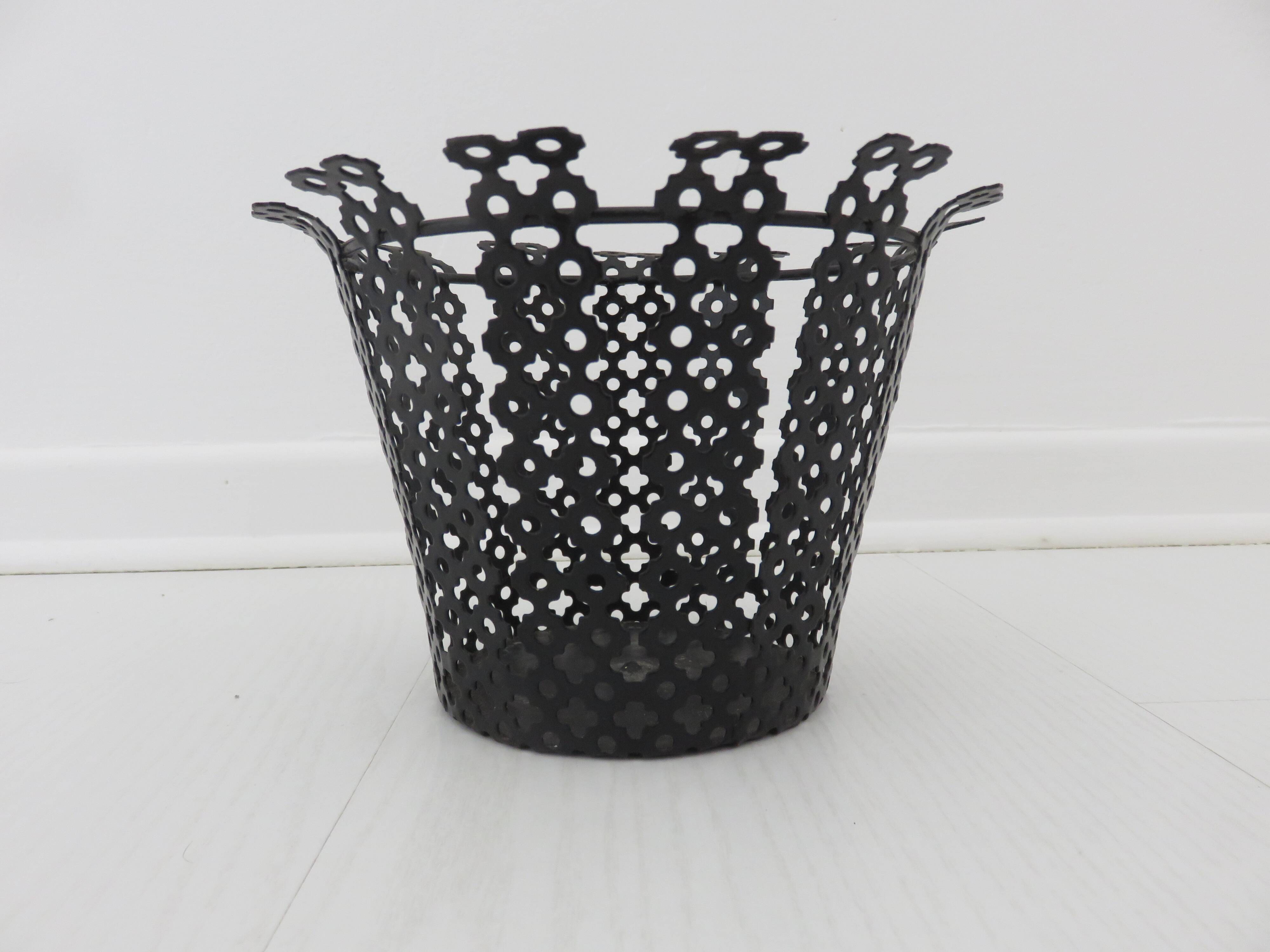 Perforated black metal cachepot from the 1950s and 1960s.