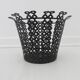 Perforated black metal cachepot from the 1950s and 1960s.