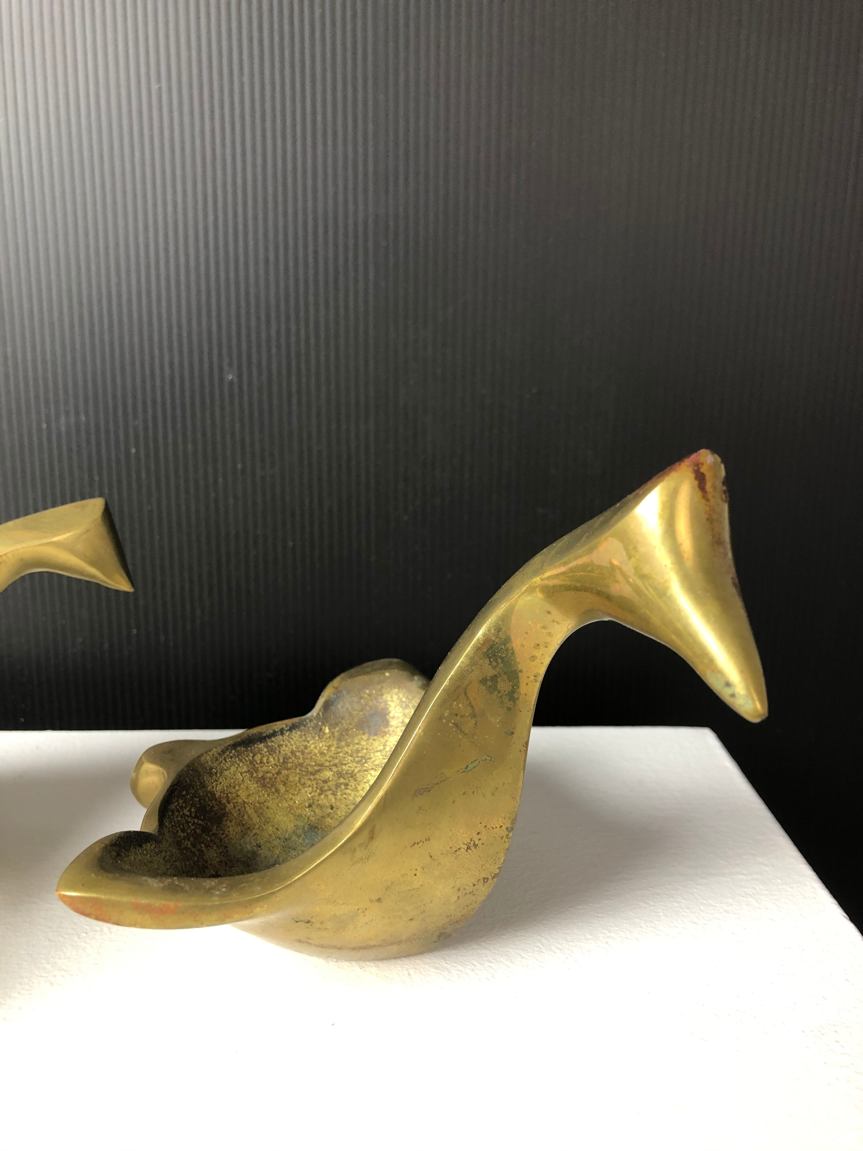 Suite of bronze "swan" ashtrays