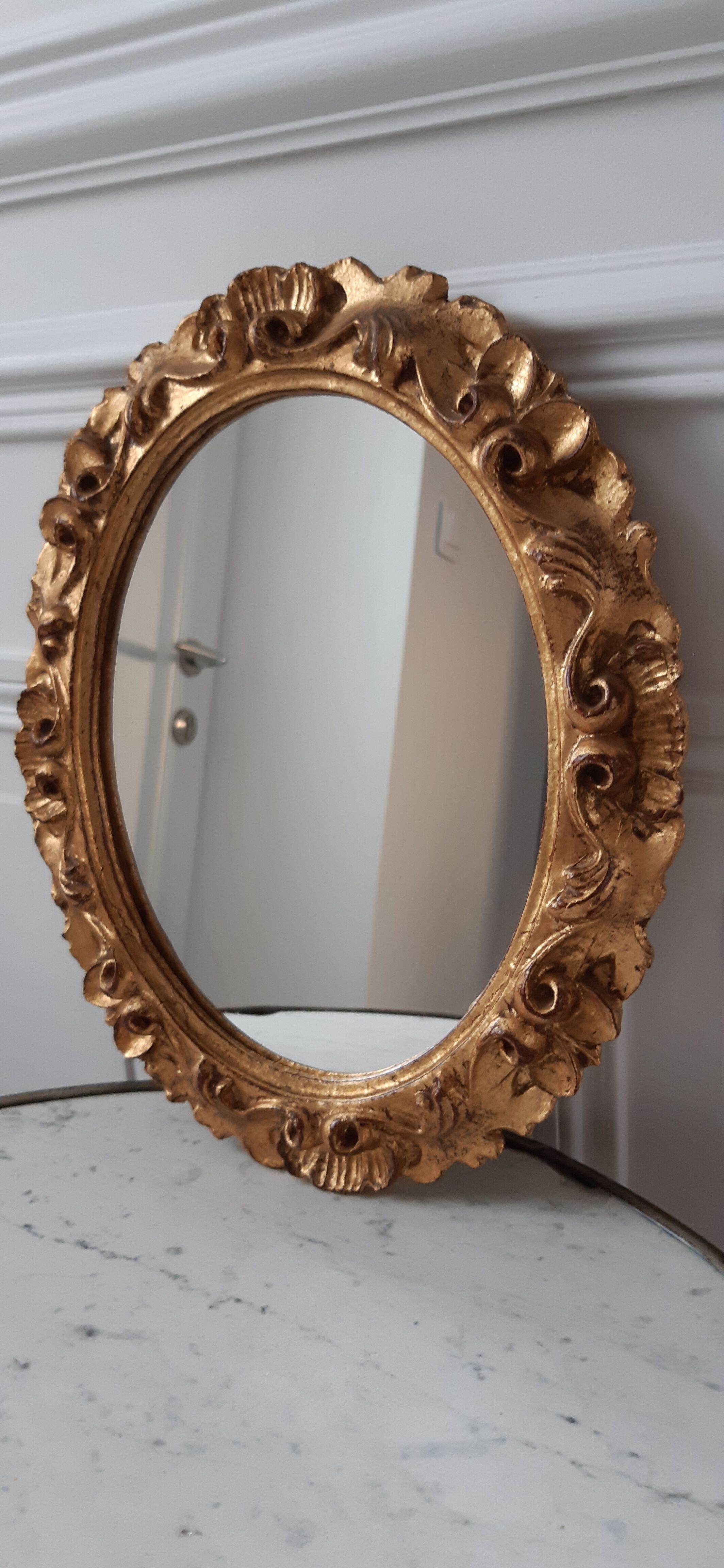 Old mirror in gilded wood late nineteenth