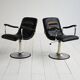 Pair of European 1970s swivel armchairs in faux leather and steel