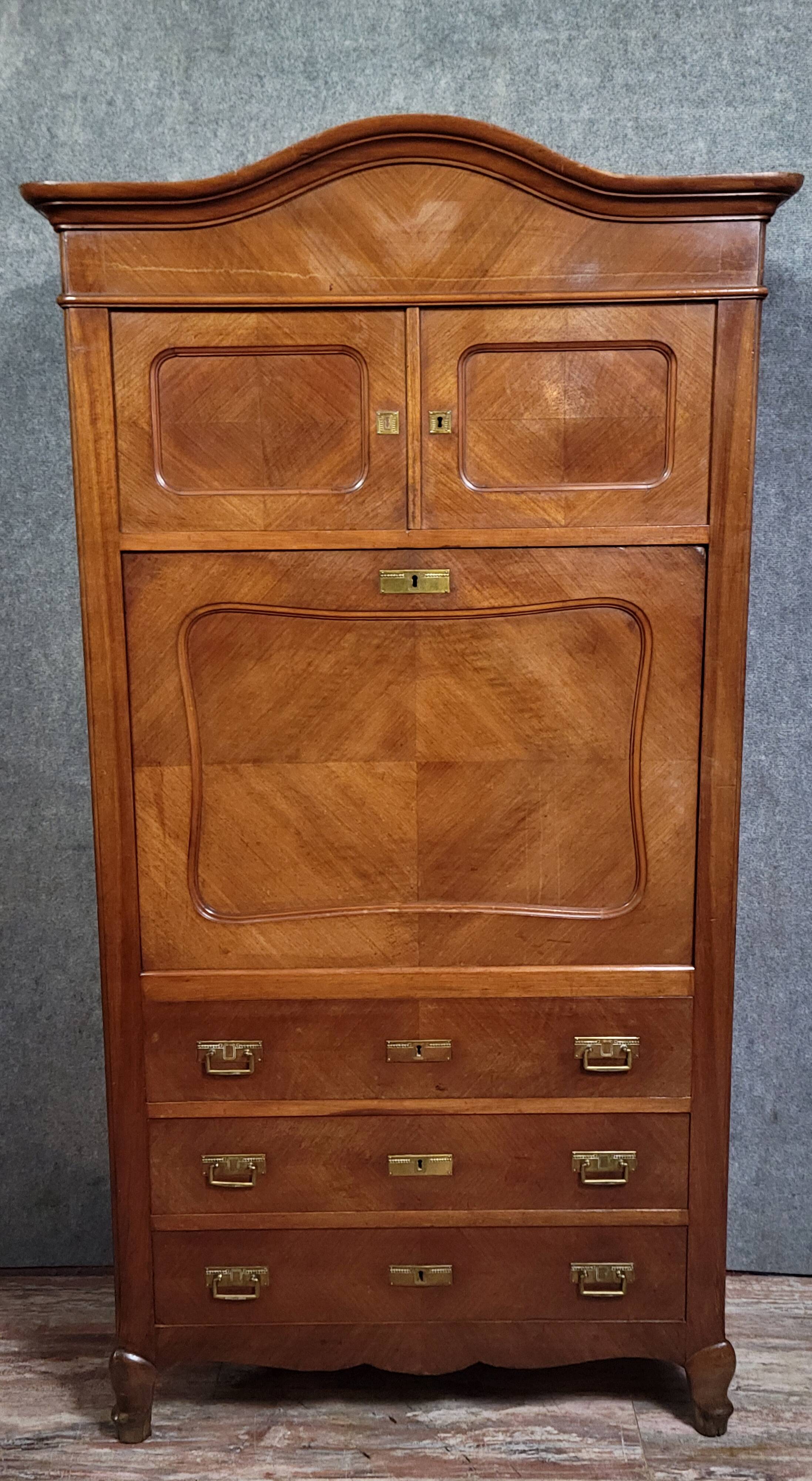 Rare Biedermeier guillotine secretary, made of walnut and marquetry.
