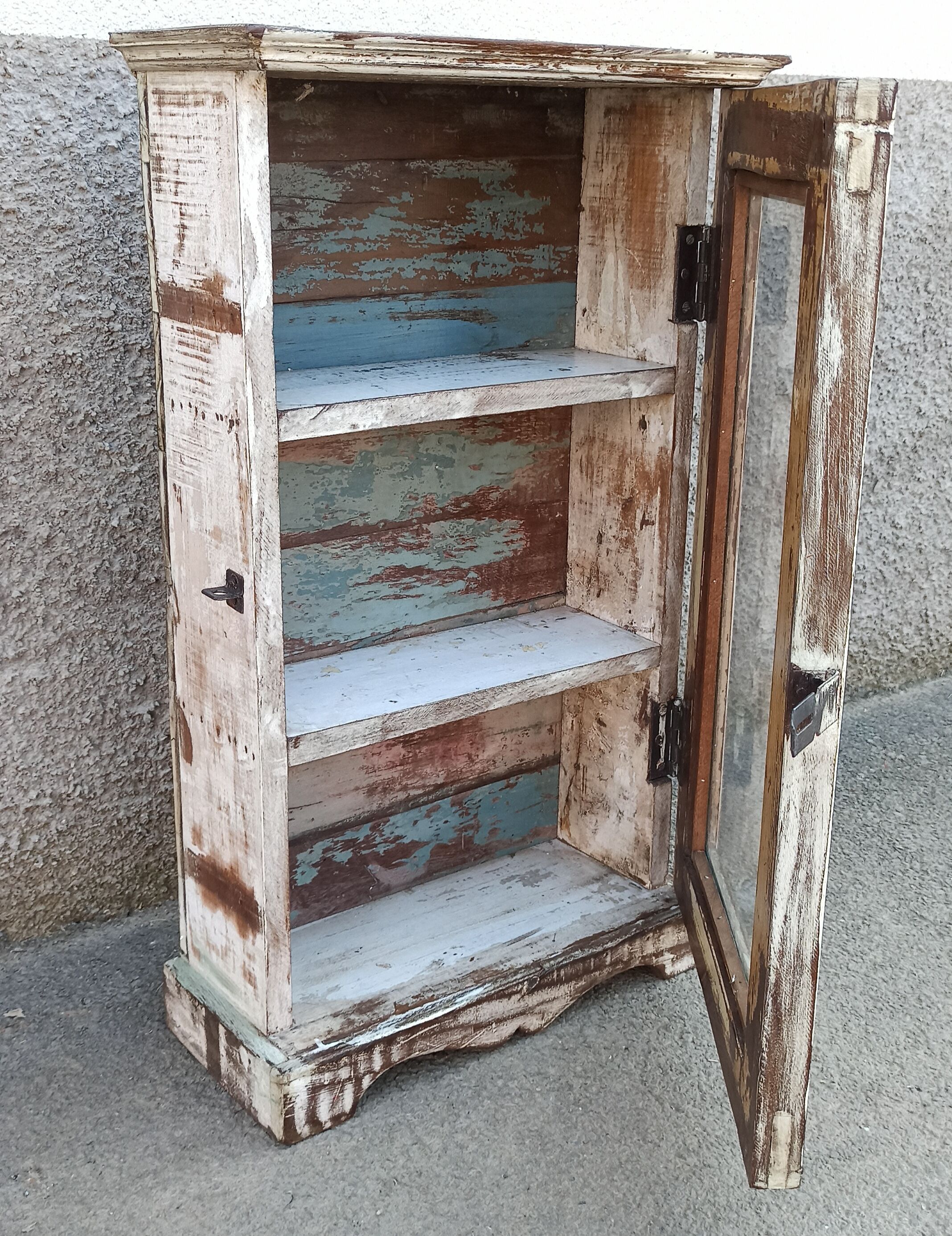 Old small wooden wardrobe with glass door