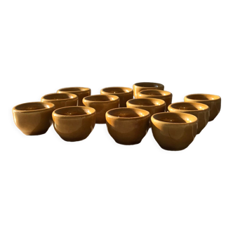 13 snail buckets or eggcups in fire porcelain glazed yellow-brown color