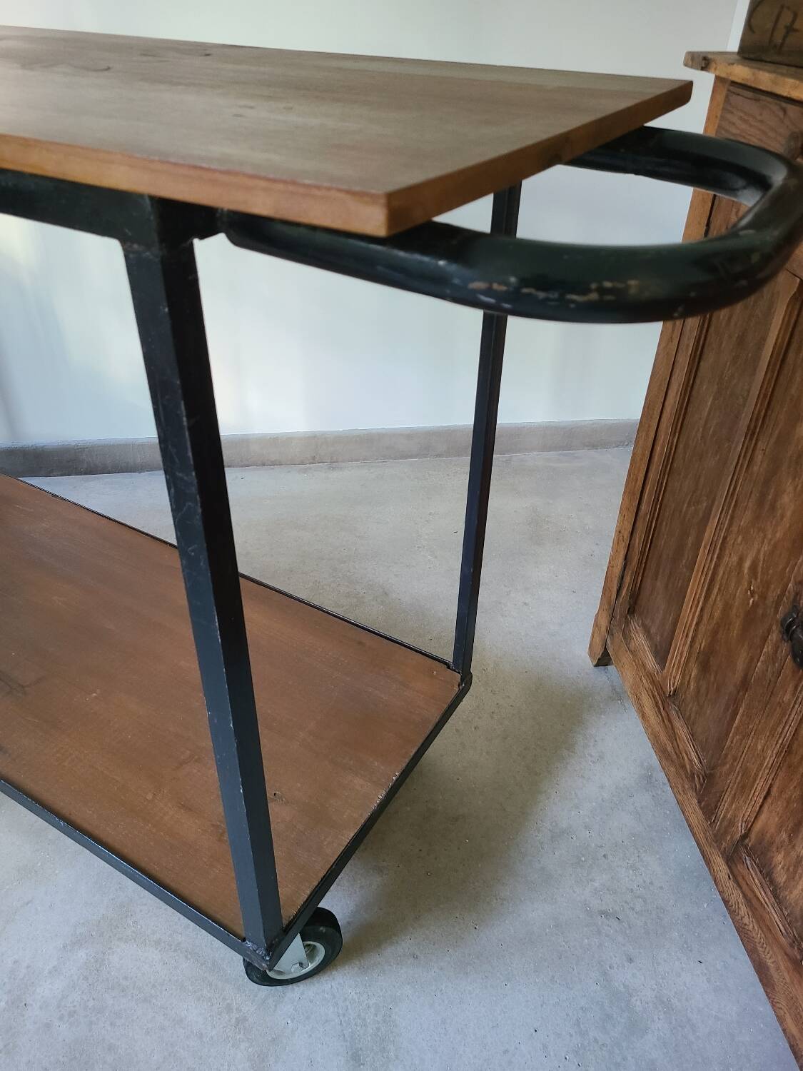 Large central kitchen island trolley on wheels serving industrial console