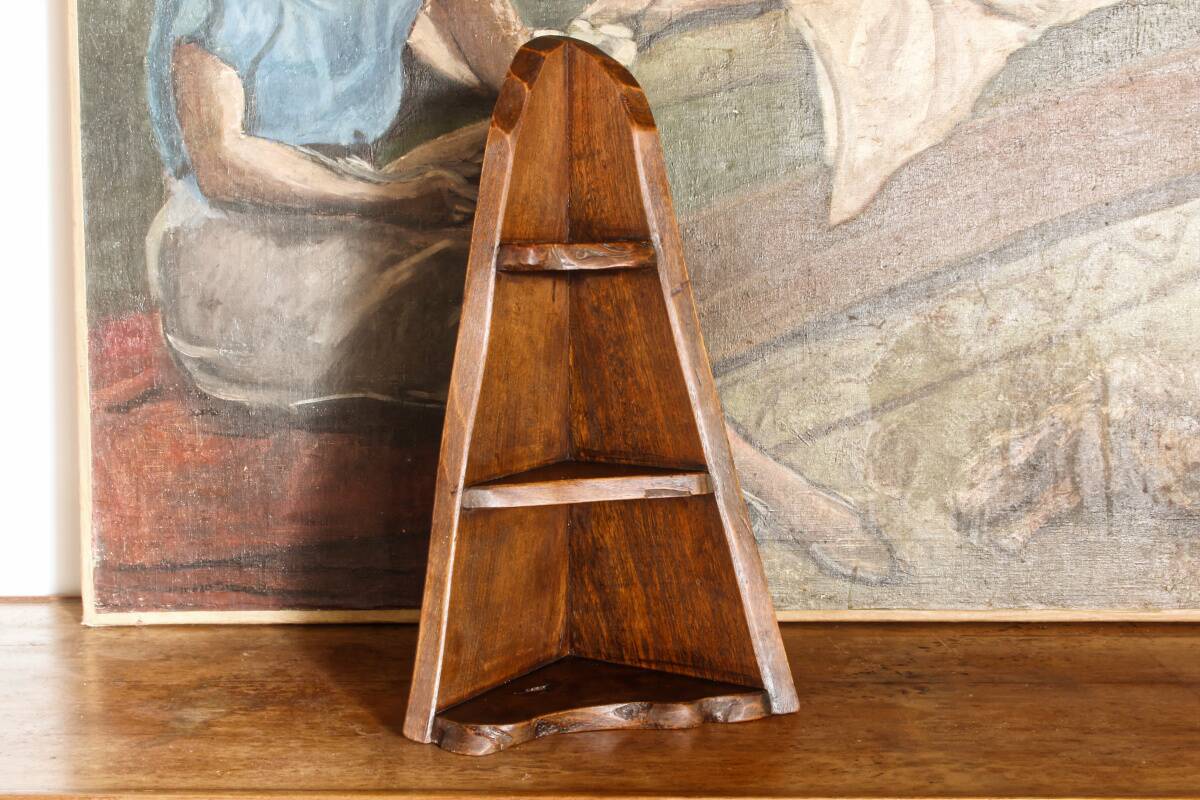Small brutalist corner shelf in solid oak.