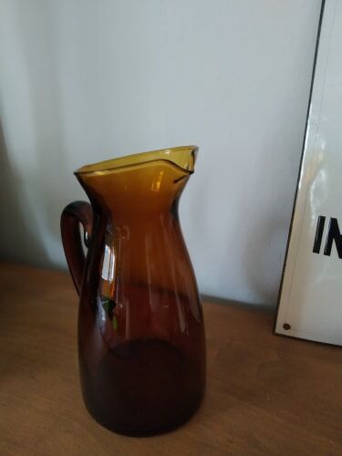 Vintage pitcher in amber glass