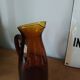 Vintage pitcher in amber glass