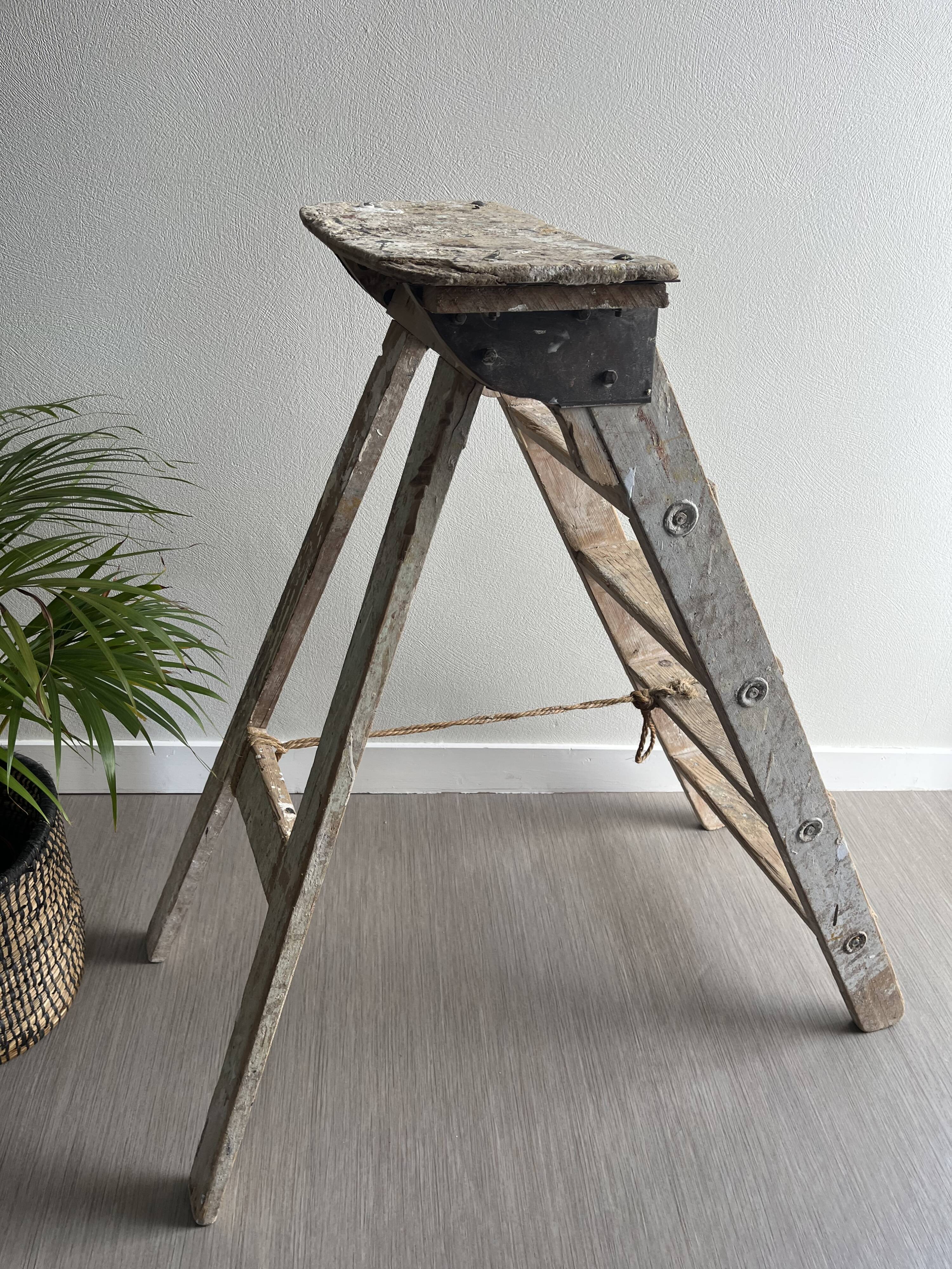 Former stepladder of patinated wood painter