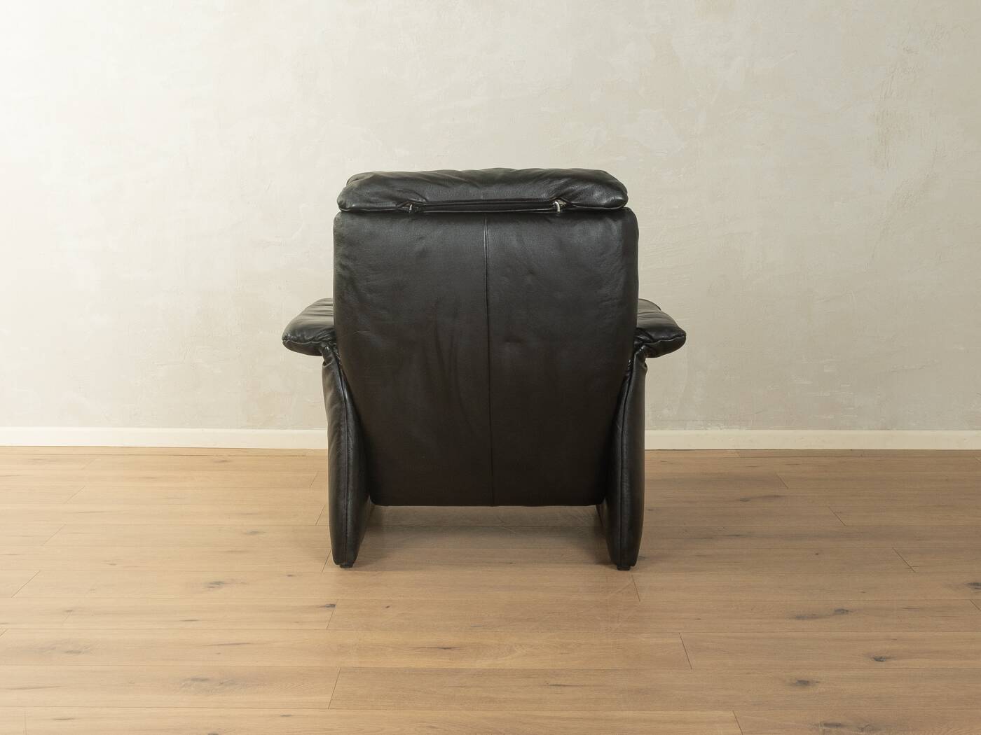 1980s cor armchair and ottoman in black leather