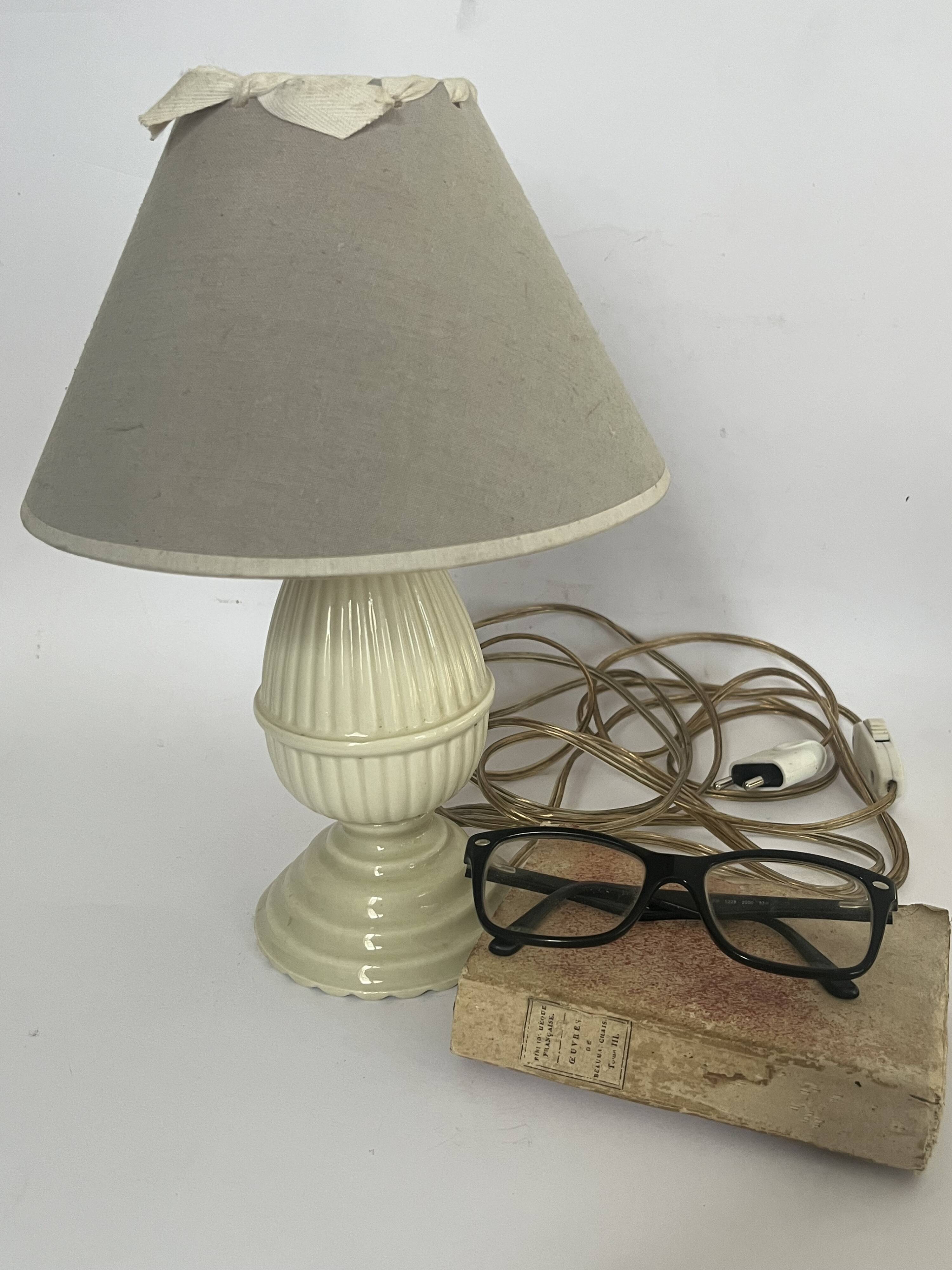 Small bedside lamp in ivory glazed ceramic.
