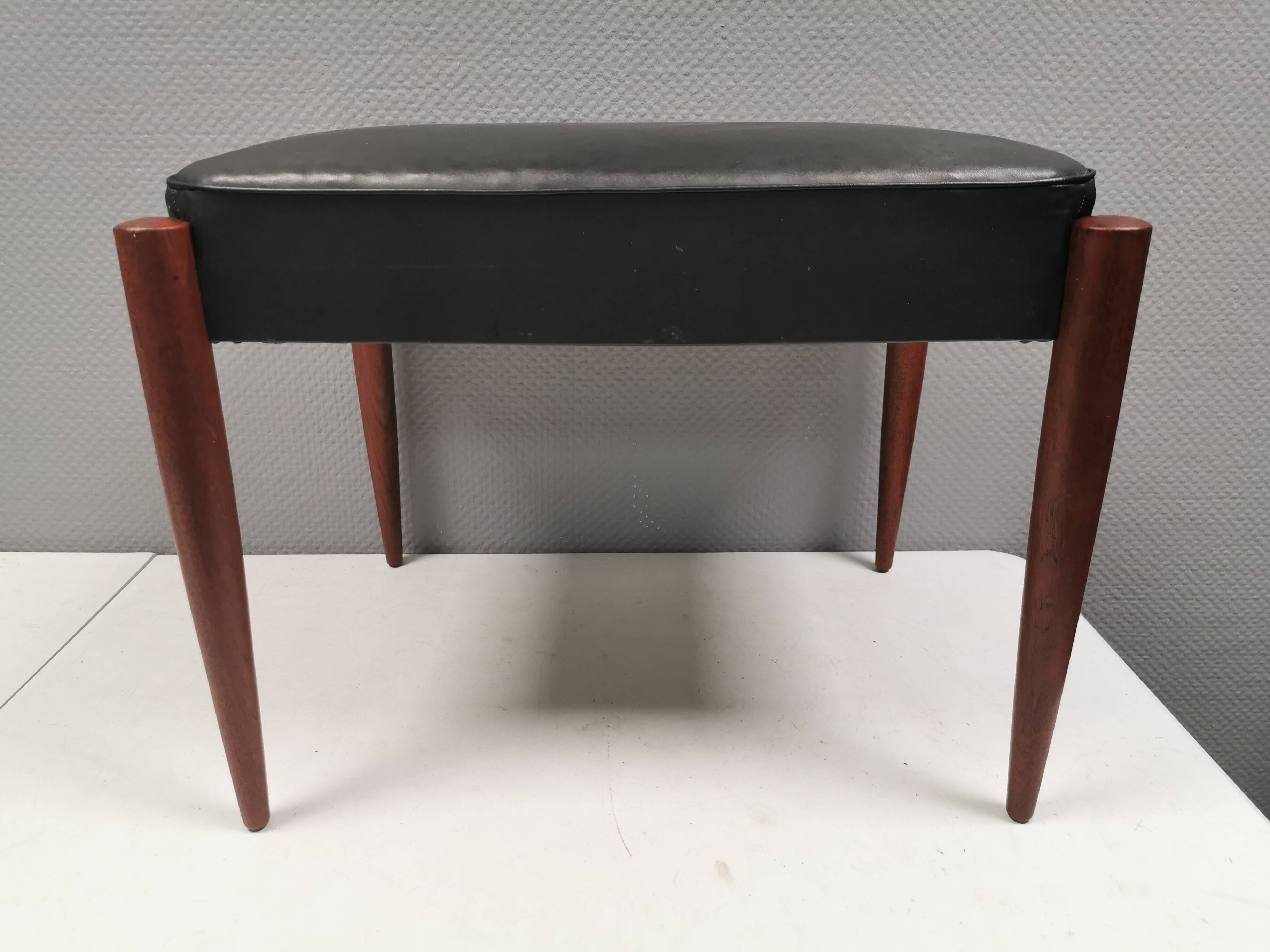 Footstool with teak wood legs and black skai (imitation leather) 1970s