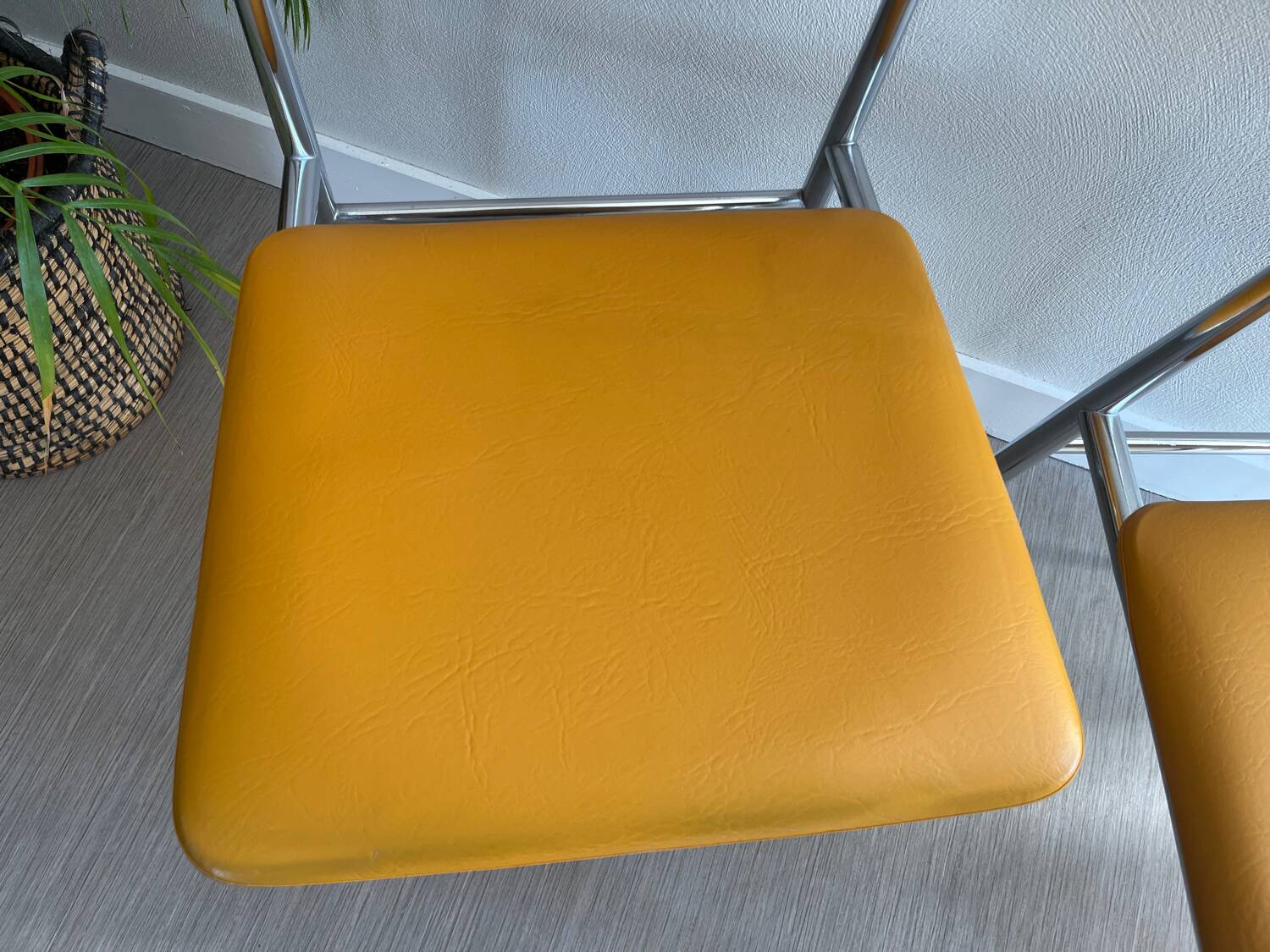 LM vintage chrome and orange/mustard yellow faux leather chairs