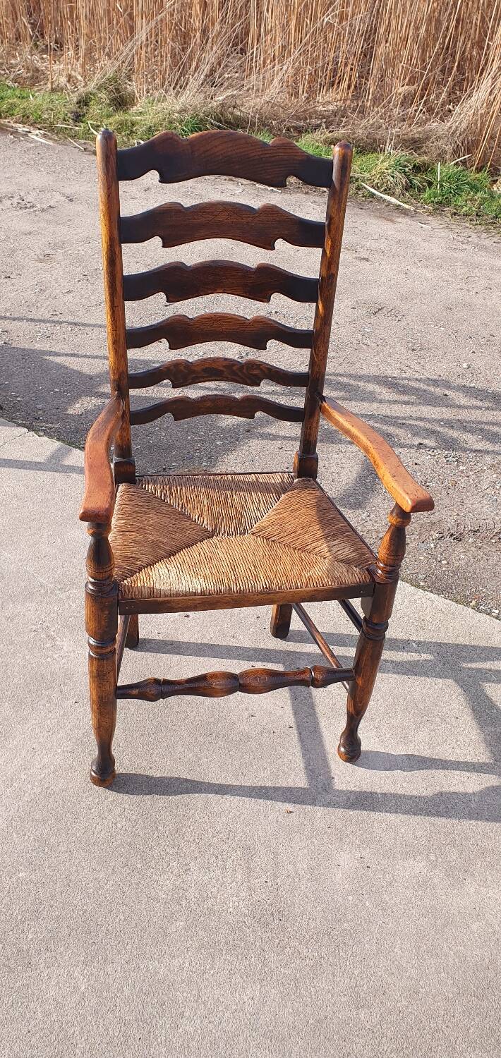 Set of 4 rustic vintage armchairs in English farmhouse style with rush seats.
