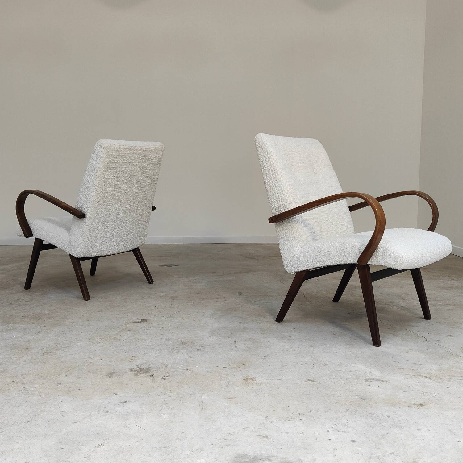 Pair of Jaroslav Smidek armchairs for Ton Bystrice, restored with white boucle, 1960.