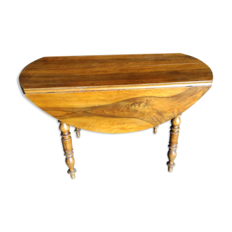 Round table with Louis Philippe shutters, walnut with two extensions.