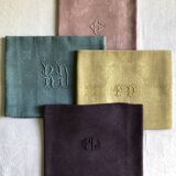 Suite of four tinted antique napkins