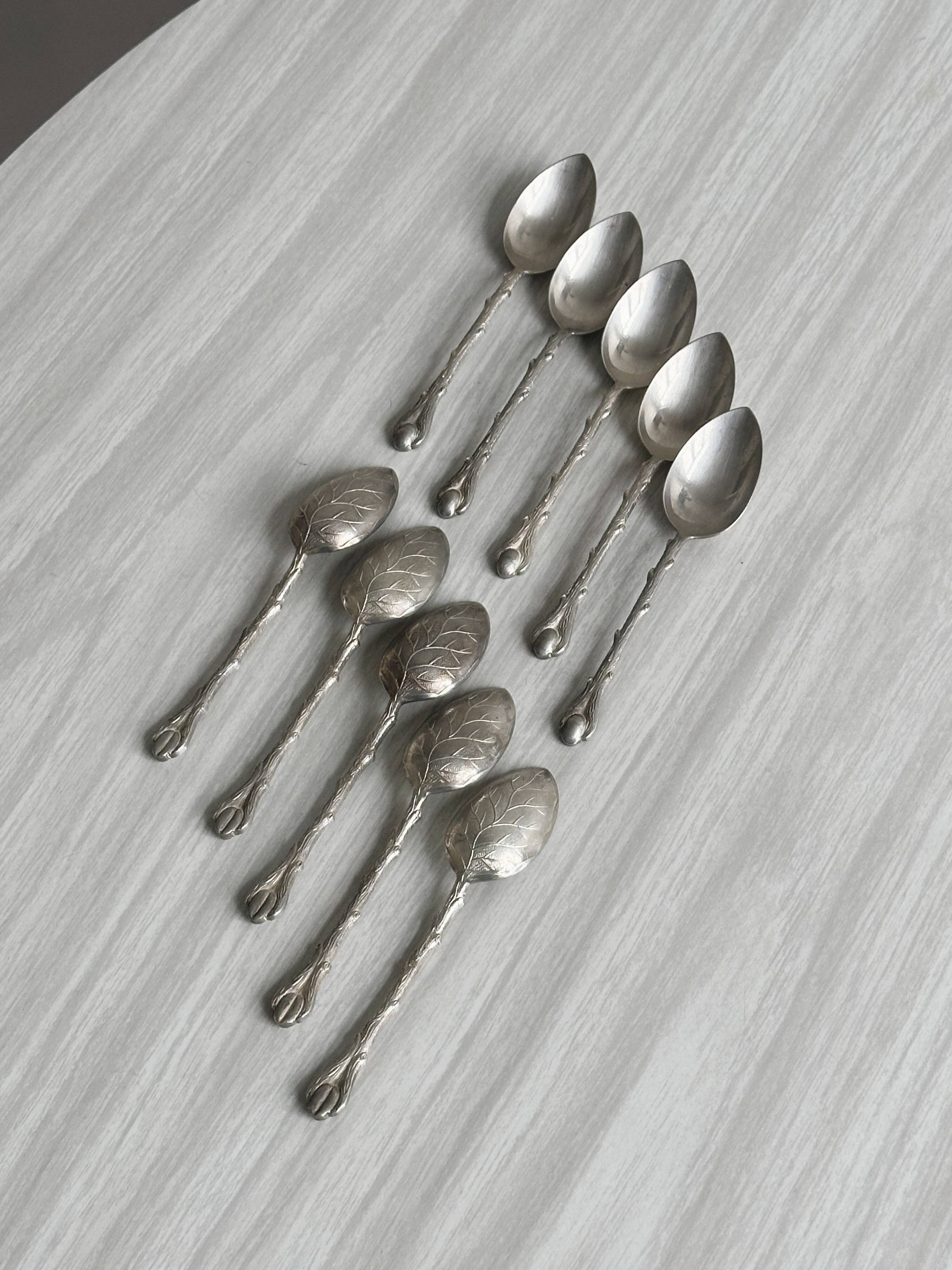 Set of 10 small silver metal spoons